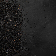 Black sesame seed on black background. Organic food concept.