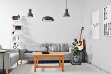 Interior of modern living room with guitar