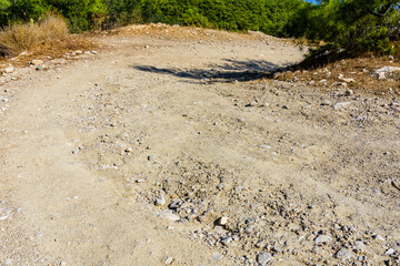 Wall Mural - Dirt road in mountains on summer