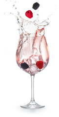 Berry fruit floating mid-air above a splashing pink cocktail isolated on white background. Girls' night  glamourous drink.