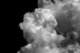 Fototapeta Tęcza - Collections of separate white clouds on a black background have real clouds. White cloud isolated on a black background realistic cloud. white fluffy cumulus cloud isolated cutout on black background