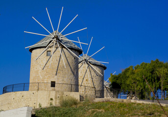 old windmill with blue sky in alacati, cesme Izmir