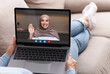 © Prostock-studio - Unrecognizable Lady Having Video Chat With Muslim Friend While Relaxing On Couch