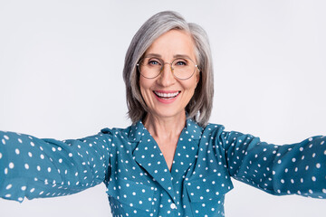 Sticker - Self-portrait of attractive cheerful glad middle-aged lady wearing blue shirt isolated over gray light pastel color background