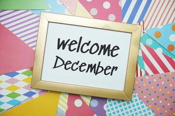 Wall Mural - Welcome December text on colorful background