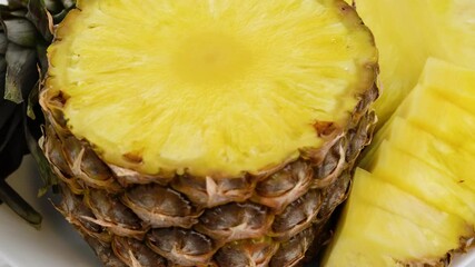 Wall Mural - Sliced pieces delicious pineapple fruit. Tropical summer food concept. Rotate