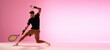 Young caucasian man playing tennis isolated on pink studio background, action and motion concept