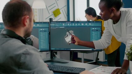 Poster - Black employee pointing on monitor explaining to project manager mechanical metalic parts of motor prototype. Industrial engineers using 3D cad program with gears shape working in creative office