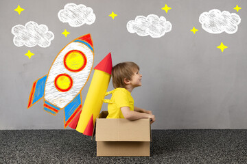 Canvas Print - Happy kid dreams about space. Imagination, freedom and motivation concept