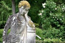 Statue Of A Woman Resting Her Face In Her Hand