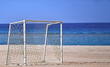 © Volodymyr - Goal soccer near sea. Goalpost on sand beach on background of blue sea and sky in summer.