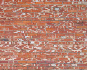 Wall Mural - The texture of the wall is made of ordinary red brick. Abstract pattern on the wall.