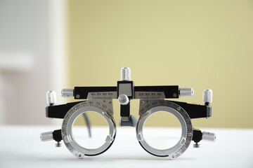 Trial frame on white table. Ophthalmologist tool