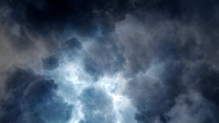 Wall Mural - dark, moving cumulonimbus clouds in the sky, a thunderstorm point of view