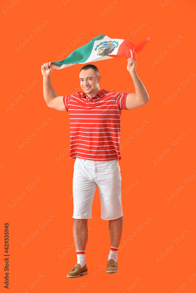 Young man with Mexican flag on color background