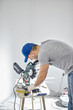 © astrosystem - Young adult man working on a DIY budget renovation of his new home apartment.