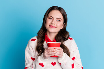 Sticker - Photo of adorable shiny young lady wear hearts print sweater drinking coffee enjoying aroma isolated blue color background