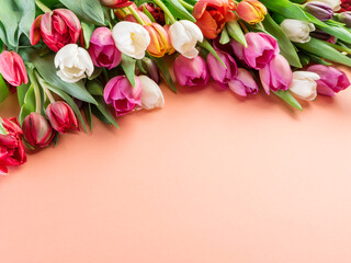 Wall Mural - Colorful  bouquet of tulips on orange background.