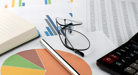 Poster - Chart, notepad, paper , calculator and pen on table