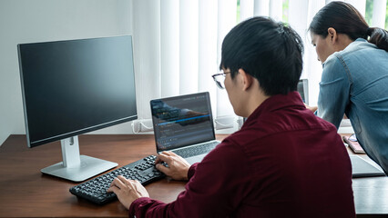 Aufkleber - Team of asian programmer looking on multiple screen laptop for brainstorm to programming about new website