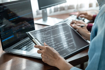 Aufkleber - Asian woman programmer holding code data on clipboard and discussion with partner about new project
