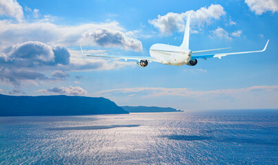 White passenger airplane in the clouds - Travel by air transport