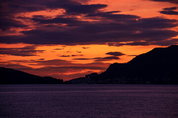 Wall Mural - Beautiful sunset in the Gulf of La Spezia view from the small village of Tellaro. On the left the famous town of Porto Venere or Portovenere. Liguria, Italy, Europe.