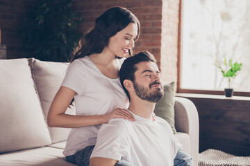 Canvas Print - Portrait of two attractive cheerful dreamy affectionate people doing massage spending free time at brick interior home indoors