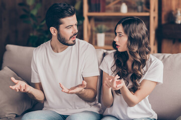 photo of unhappy upset negative mood couple talking about problems troubles having conflict in relat