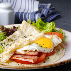 Wall Mural - Omelet with fried egg, bacon and tomatoes. Morning Breakfast concept