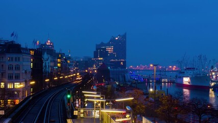 Sticker - Hamburg, Germany. Landungsbrucken station of the city Rapid transit rail system. Time-lapse during the cloudy rainy morning from night to day in Hamburg, Germany, panning video