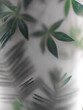 Leaves of large tropical plants behind frosted glass. The background of the jungle and the tropics