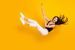 canvas print picture - Full length body size photo of woman wearing casual clothes falling down isolated on vibrant yellow color background