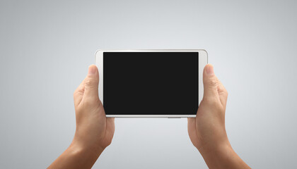 Hands holding tablet touch computer gadget