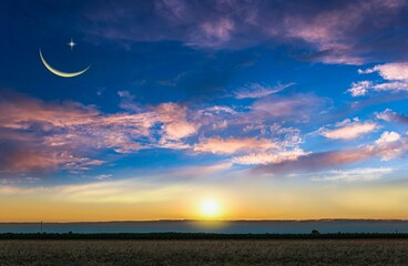 Wall Mural - crescent moon with beautiful sunset background . bright sky