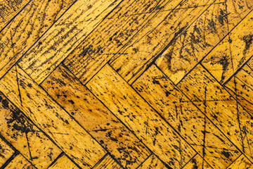 Poster - old yellow parquet in scratches. shabby wooden texture. background for design