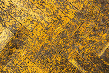 Poster - old yellow parquet in scratches. shabby wooden texture. background for design