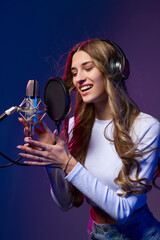 Canvas Print - Girl blogger recording audio podcast or singer