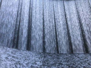 Urban waterfalls cascading down abstract background