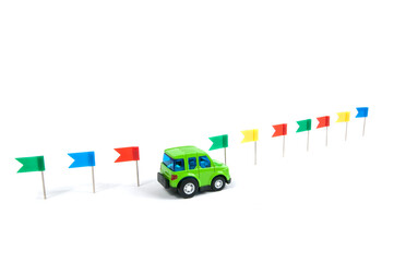 the car rides along the colorful flags on a white background isolated, the concept of traveling by car