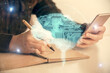 © peshkova - Double exposure of brain sketch hologram and woman holding and using a mobile device.