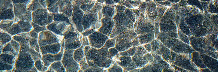 pebble water caustics background with color refractions