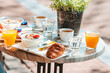 © travnikovstudio - Fresh and delisious breakfast in outdoor cafe at european city