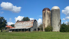 An Old Barn And Silo.