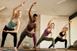 © Drazen - Multi-ethnic group of female athletes practicing on Pilates class in health club.