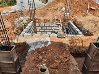 Canvas Print - New building construction with cement block and artificial sand in a rural area