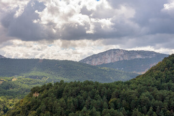 Sticker - Beautiful shot of greenery-covered mountains and hills