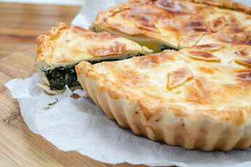 Spinach Pie with Egg or Spinach Quiche Lorraine. Salty tart with vegetables, spinach and egg. Home food, healthy and natural concept.