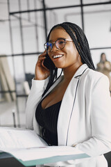 Wall Mural - Portrait of a confident black businesswoman working at office