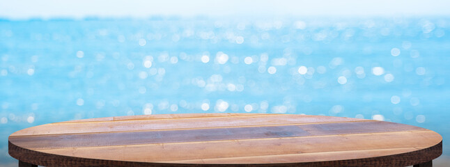 Aufkleber - Empty round wood table with summer blue sea blur background.copy space for display of product on online media